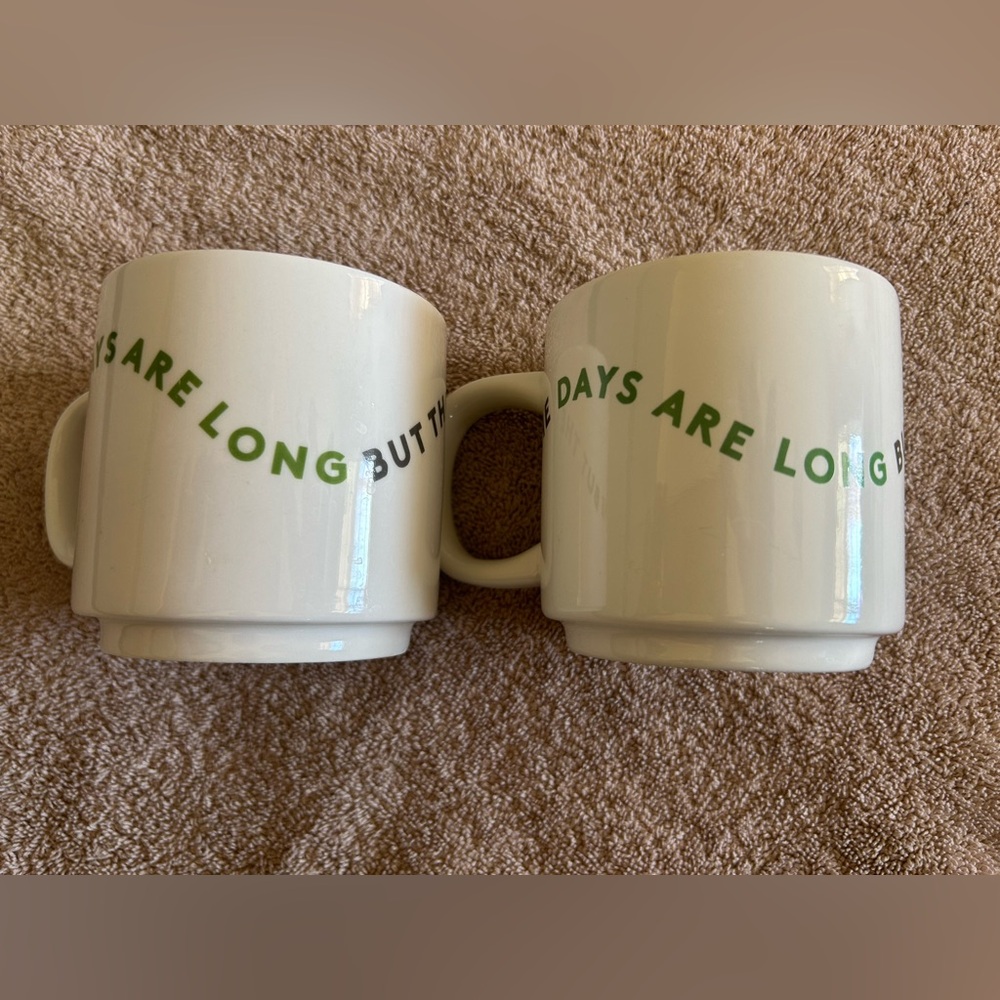 Elegant White Mugs with Green Text
